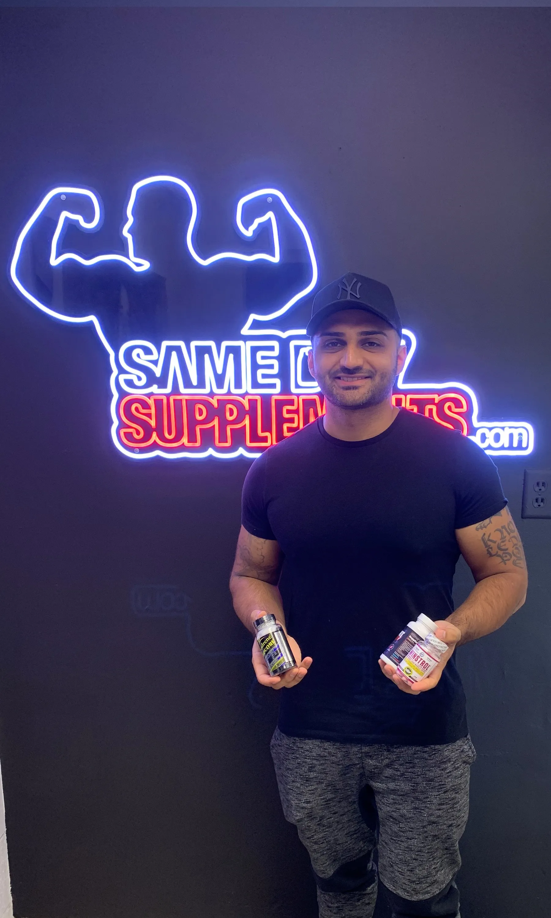 Customer holding Lipodrene Hardcore, Winstrol and Alpha Lion Cravings Killer