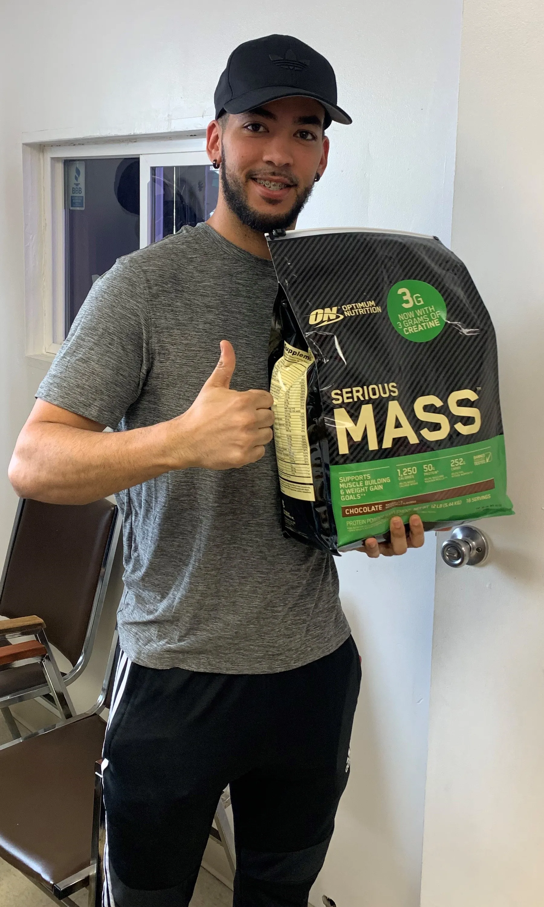 Customer giving thumbs up with Serious Mass protein
