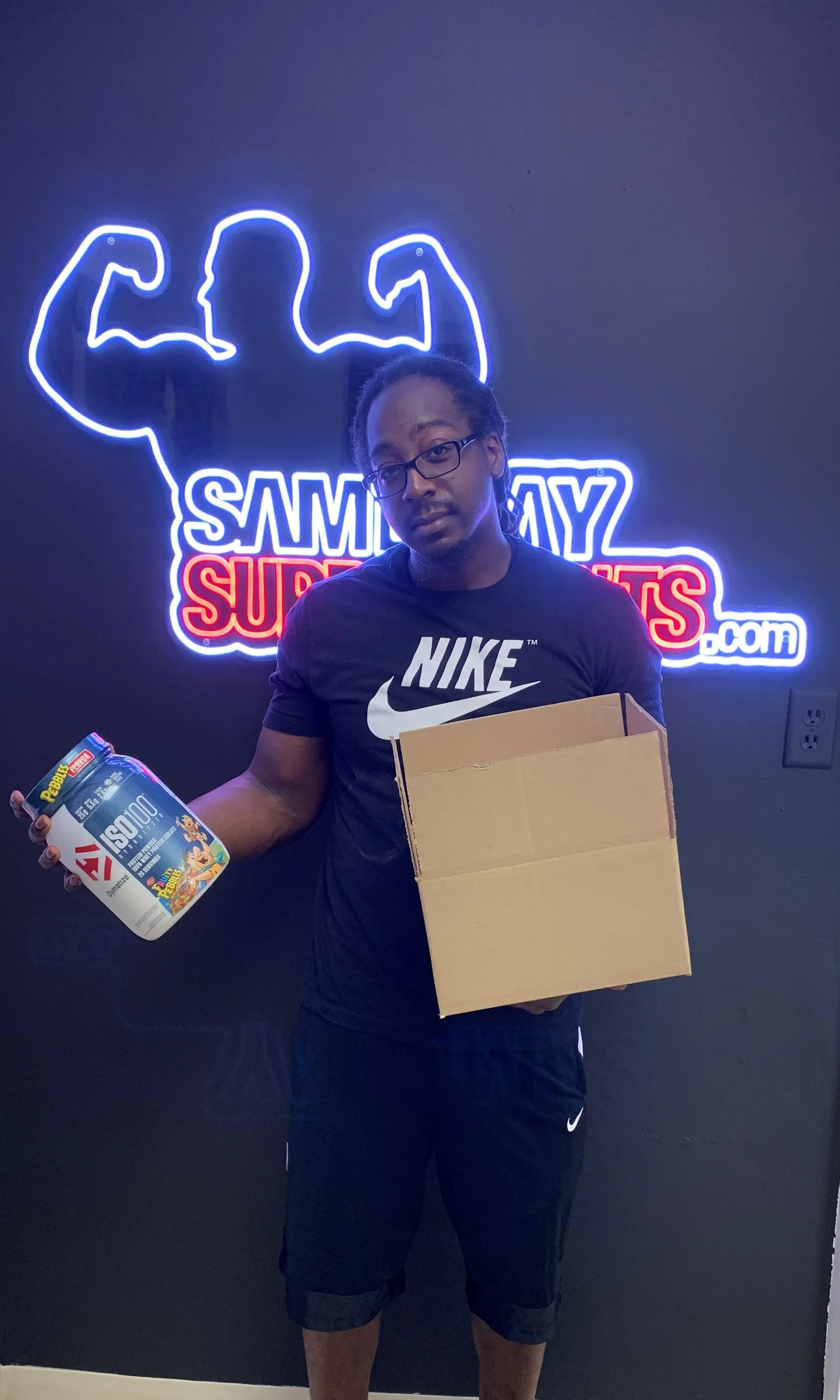 Customer holding ISO100 protein and shipping box